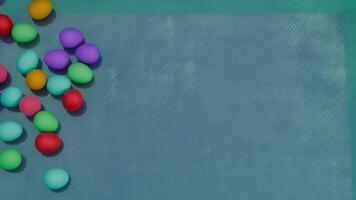 Eggs colorful rolling on the surface video