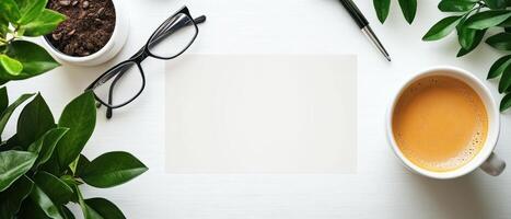 un sereno espacio de trabajo presentando blanco revista cubrir disposición, rodeado por verdor, anteojos, café, y bolígrafo, creando calma y atractivo atmósfera. foto