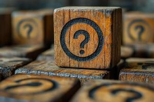 Wooden blocks with question marks create sense of curiosity and intrigue. close up highlights texture and detail of wood. photo