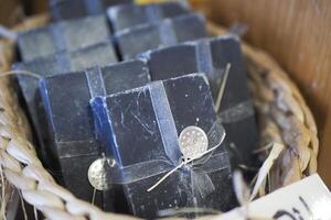Beautifully crafted Handmade Black Soap Bars elegantly arranged in a Rustic Basket for you photo