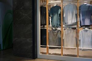 Chic and Stylish Display of Apparel in a Modern Retail Storefront for Shoppers to Enjoy photo