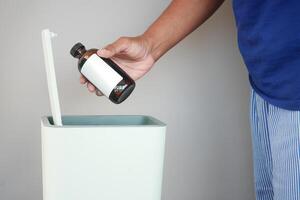 Properly Discarding Unwanted Medicine by Placing It in a Trash Bin Safely and Effectively photo