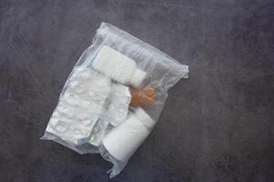 Packaged Medication Items Conveniently Stored in a Plastic Bag for Easy Access and Organization photo