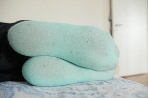 Enjoying the Bliss of Comfortable Feet Resting Peacefully on a Soft and Inviting Surface photo