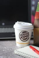 WASHINGTON - USA - August 17, 2024 - A moment of pause A coffee cup and a notebook on a desk, creating a peaceful workspace. photo