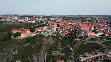 Aerial side view of Znojmo city with castle and St. Nicholas cathedral in Czechia in August 2024 video