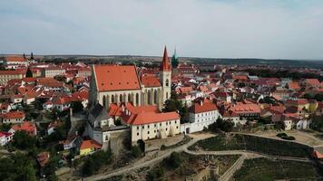 Aerial orbiting view of Znojmo city with castle and St Nicholas cathedral in Czechia in August 2024 video