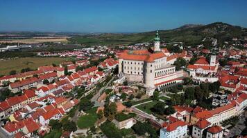 Aerial descending view of city and chateau Mikulov in Czechia in September 2024 video