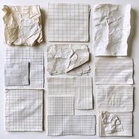 A collection of crumpled graph and lined paper sheets arranged in a grid pattern, showcasing texture and imperfection photo