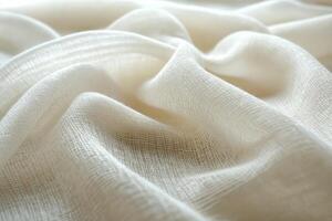 Soft, flowing white fabric with a delicate, airy texture, creating gentle waves and a light, ethereal appearance photo