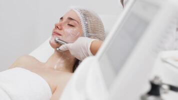 A cosmetologist performs RF lifting for facial rejuvenation and tightening. This non-invasive procedure effectively firms and smooths skin, enhancing your beauty routine video