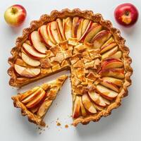 a pie with apples and a slice missing photo