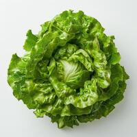 a green leafy vegetable on a white surface photo