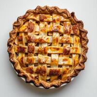 a pie with a lattice of cheese on top photo