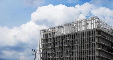 Panoramic view where workers are working on a big construction site and many cranes are working in, new building business industry. photo