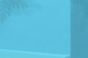 Empty shelf on blue wall background. Composition with monstera leaves shadow on blank wall for advertising, mock up for presentation photo