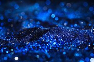 Spectacular Blue Bokeh Lights on Dark Glittering Surface photo