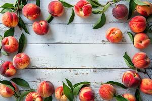 top view composition ripe sweet peaches with leaves border frame on white wooden background with copy space photo