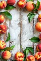 vertical top view ripe sweet peaches fruits and leaves border frame on white wooden background flat lay template with copy space photo