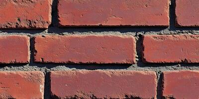 Close-up of a red brick wall with mortar joints photo