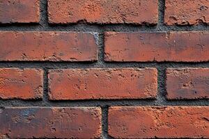 Close-up of a red brick wall with dark mortar photo