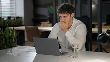 Shocked Caucasian businessman with laptop failure in office business man shock problem fail lose online trouble company crisis male professional computer stress worker bankrupt browsing pc crash error photo