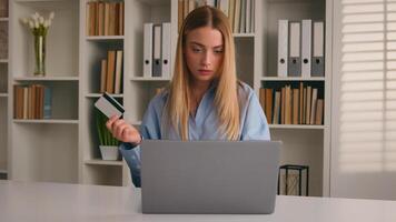 Caucasian confused woman try to pay order online shopping with laptop in internet store problem with payment girl client buying in web shop wrong password trouble failure with bank credit card error photo