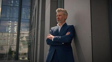 Smiling old senior Caucasian man mature retired middle-aged male employer business entrepreneur businessman good happy agree recommend showing thumb up gesture approval excellent result sign in city photo