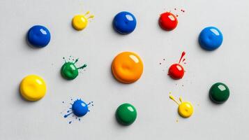 Multicolor paint bubbles bursting with vivid splashes on a textured grey background photo