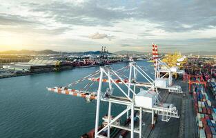 Logistics and transportation of container cargo ship at ship port. Container truck and crane bridge in shipyard. Import export and transport industry. Terminal port for export transport by ship. photo