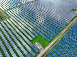 Aerial view of solar farm. Sustainable renewable energy and modern photovoltaic technology for eco-friendly electricity production. Solar power station. Green energy solutions. Solar panel technology. photo