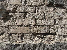 Old grey brick wall. ancient wall. Masonry texture, stonework pattern background for wallpaper or graphic design photo