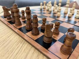 Close up photo of chessboard on wooden table. Chess playing benefits