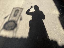 Woman and chair shadow with copy space for background and graphic design photo