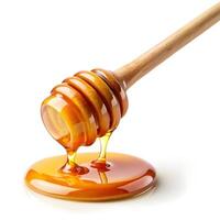 dripping honey from honey stick photo