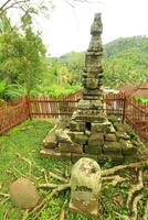 A Stone Wall With A Fence And A Stone Wall With A Fence Around It photo