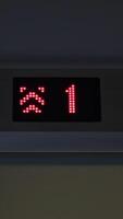 Display of an elevator going up indicating the floor number passing with red arrows. Concept. LED screen, interior. video