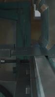 The process of metal sheet bending on a CNC bending machine. Creative. Worker hands and the equipment at the factory. video