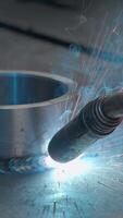 Close-up welding with sparks and metal ring. Creative. Welder welds metal ring with sparks. Sparks from welding with metal ring at factory or in forge video