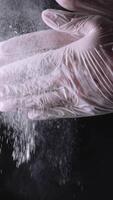Close-up of a chef wiping flour from hands. Frame. Slow motion particles of dust. Clap chef. Chef clapping hands covered in flour. End of a work day concept video