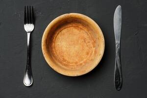 Empty bowl on dark background with copy space photo