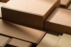 Stacked cardboard boxes arranged in a neat pattern under natural light photo