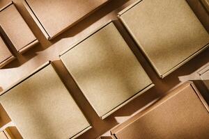 Multiple cardboard boxes arranged on a surface for packaging and shipping in a warehouse setting photo