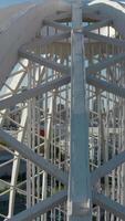 Top view of domed structure with beams. Stock footage. Beautiful architecture of metal dome with beams. Dome made of metal semi-arches with air space on background of modern city video