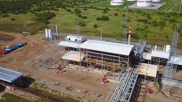 Urban industry from drone. Action. A view from a height to the outskirts with tall chimneys from where smoke comes out. video