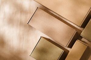 Brown cardboard boxes arranged on a neutral background in a warehouse setting during daylight hours photo