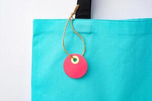 Eco bag for shopping with blank tag on white background photo