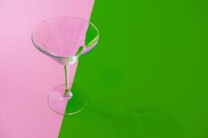 Empty transparent glass on a color background with copyspace. photo