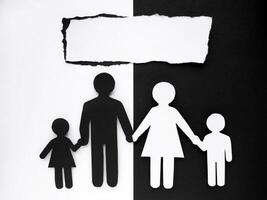 Symbol of a person and family cut out of black and white paper. Interracial family. Space for text. mixed race marriage photo