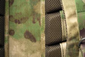 Close up still life of a green army tactical backpack photo